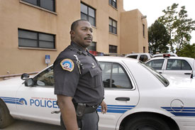 Germaine Casey in uniform next to vehicle